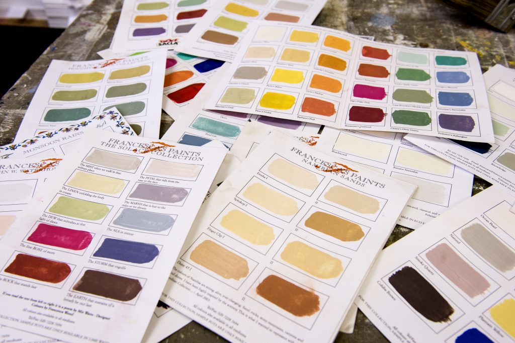 Consultation with colour samples laid out on a table